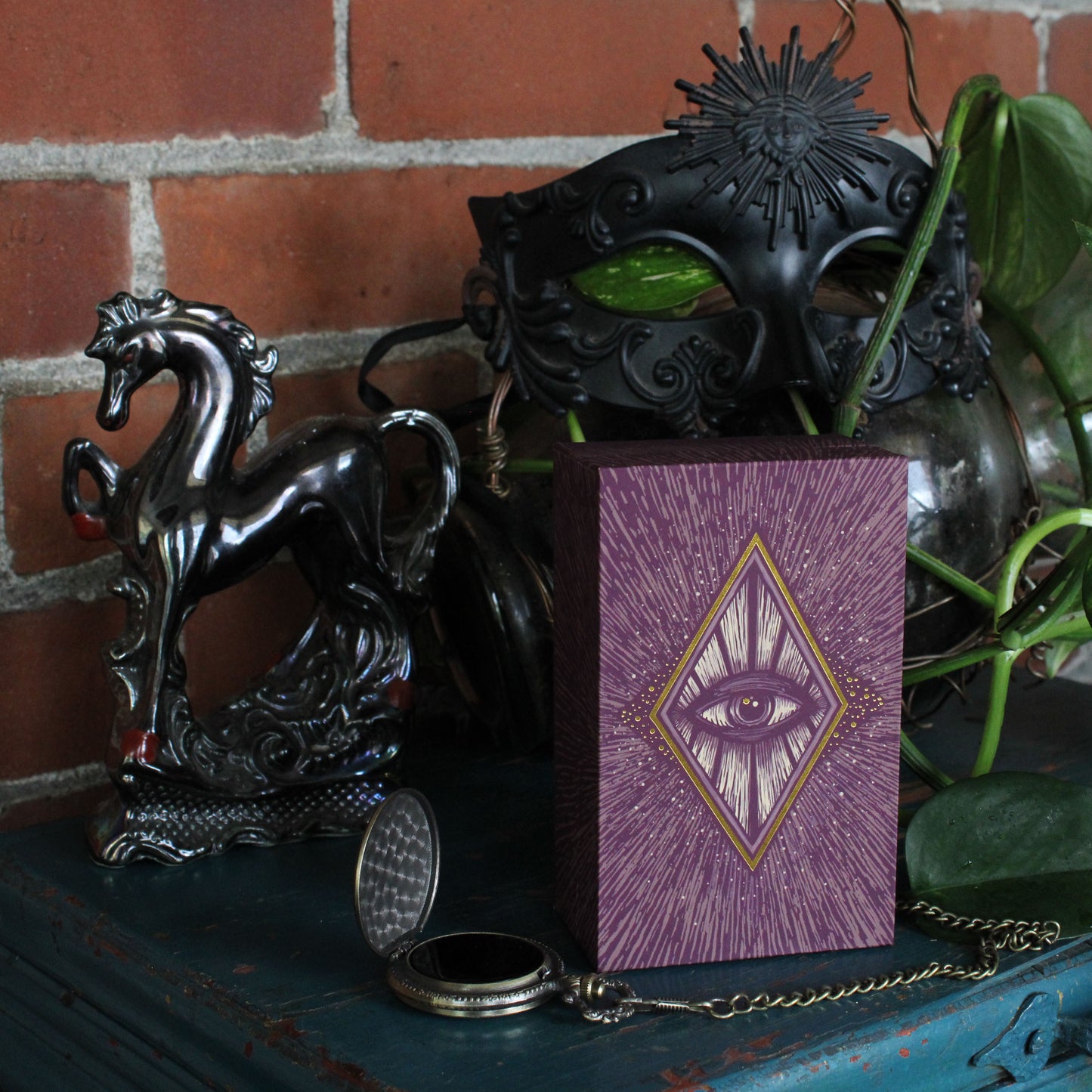 Light vision tarot deck with purple and gold.