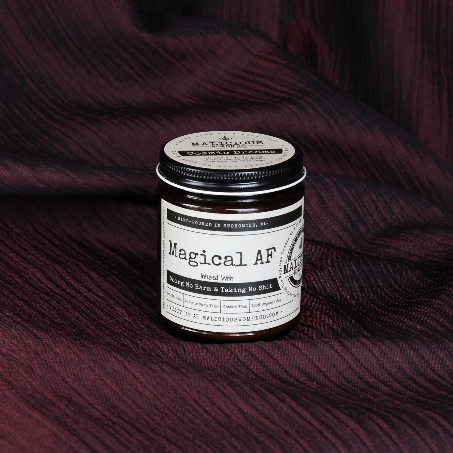 Magical as fuck candle infused with doing no harm and taking no shit.  Malicious Women Co.